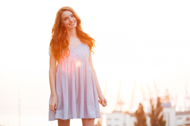 Free photo smiling ginger girl in dress