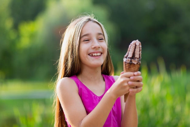 Smiling girl holding ice cream