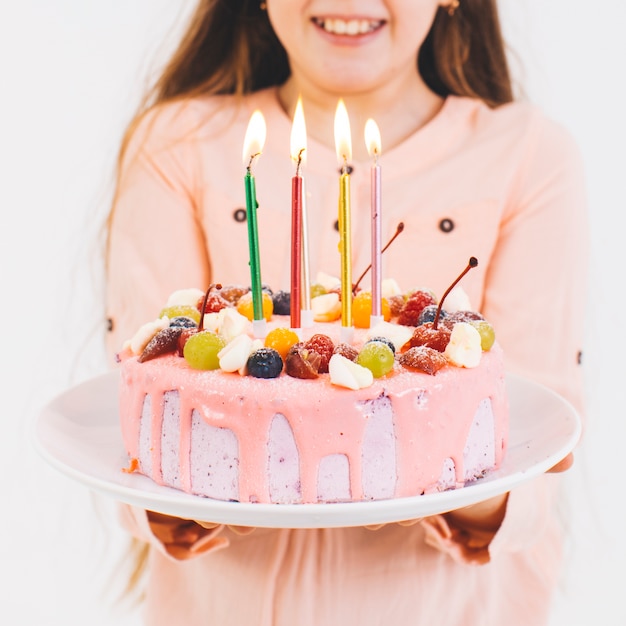 Free photo smiling girl with a birthday cake