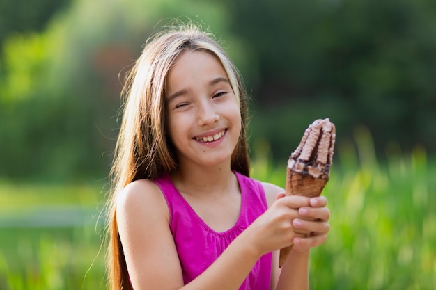 Smiling girl with chocolate ice cream