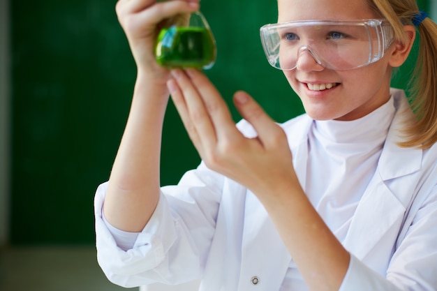 Smiling girl with her experiment