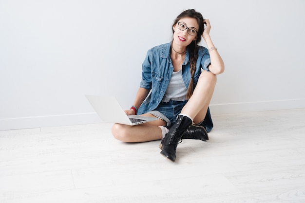 Smiling girl with laptop