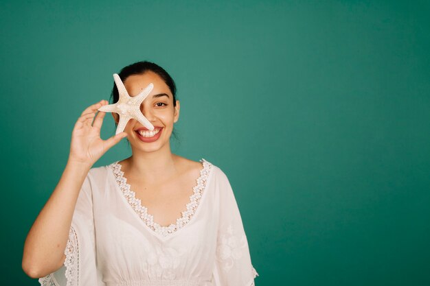 Smiling girl with starfish