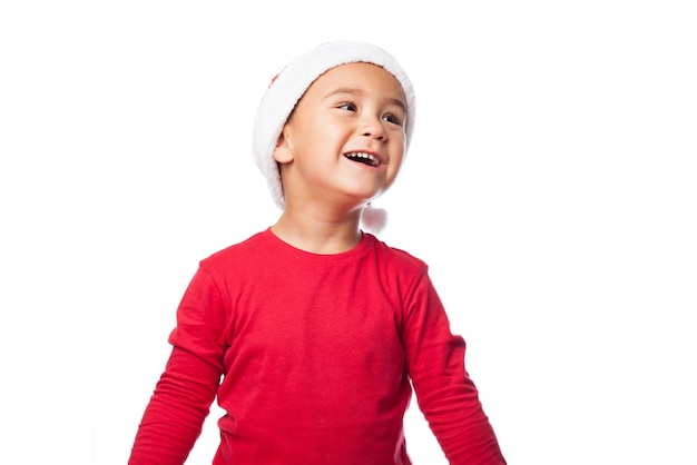 Smiling kid with a santa's hat