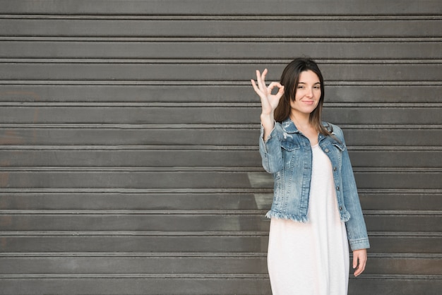 Smiling lady with ok gestures