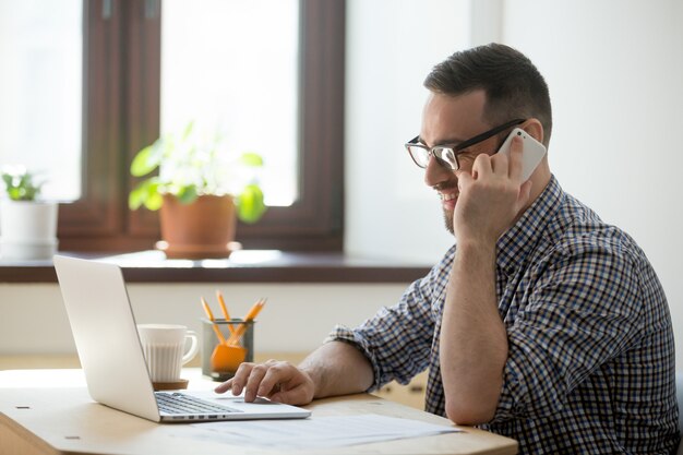 Smiling male consulting client online