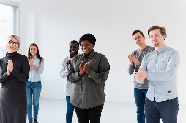 Free photo smiling male and female patients applauding