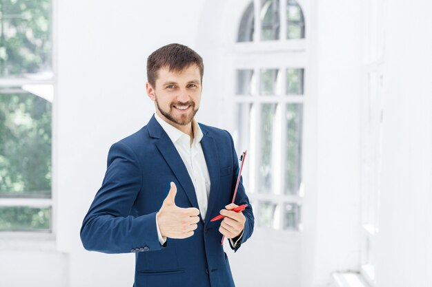 The smiling male office worker