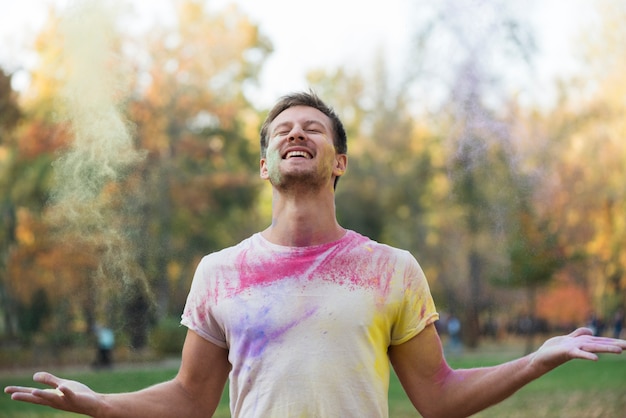 Smiling man enjoying holi festival