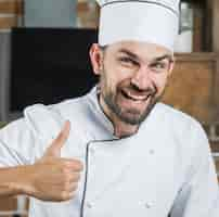 Free photo smiling man showing thumb up sign