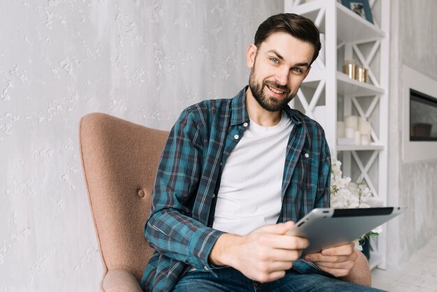 Smiling man with tablet