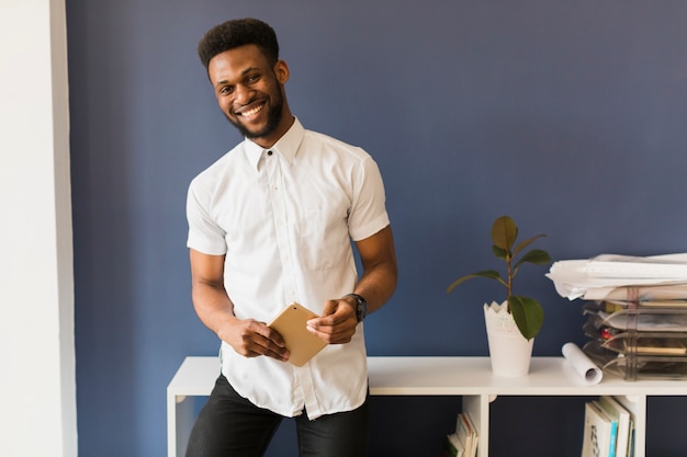 Smiling man with tablet