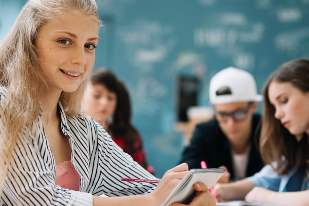 Free photo smiling teen girl educating