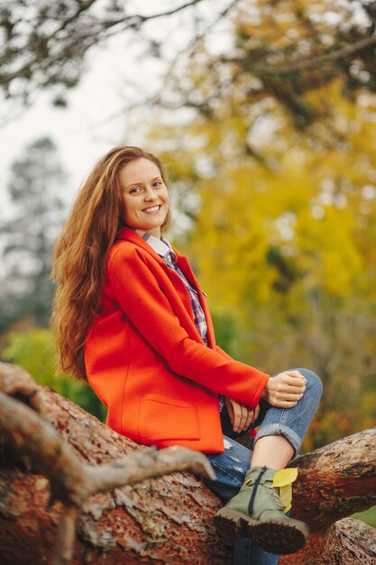 Smiling woman autumn portrait.