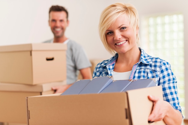 Smiling woman during the moving house