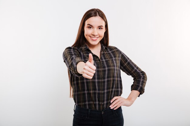 Smiling Woman in shirt showing thumb up