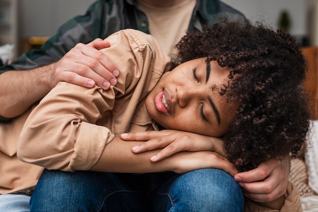 Free Photo smiling woman sleeping embraced by man