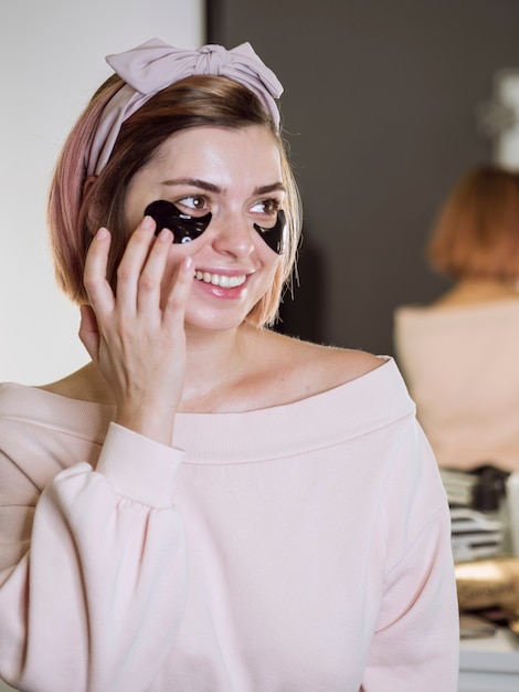 Smiling woman wearing face mask