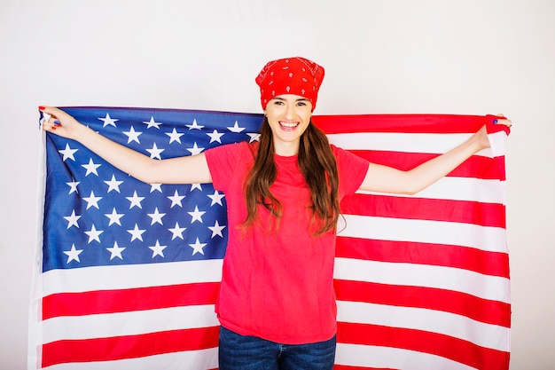 Free Photo smiling woman with big american flag