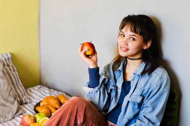 Smiling woman with breakfast