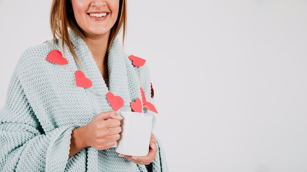 Free Photo smiling woman with cup and plaid