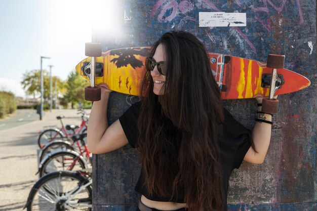 Smiling woman with longboard