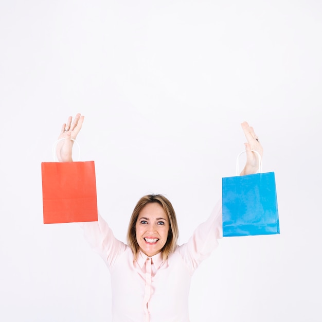 Smiling woman with paper bags