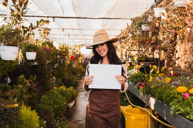 Smiling woman with paper sheet