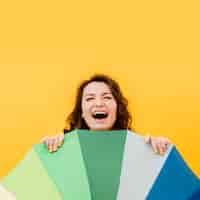 Free photo smiling woman with rainbow umbrella