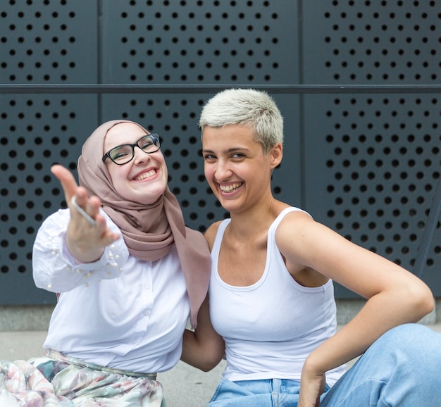 Free Photo smiling women facing the camera