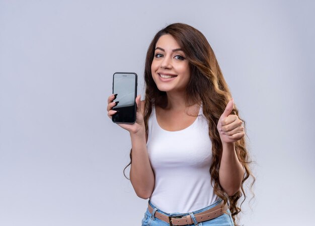 Smiling young beautiful girl holding credit card  with copy space