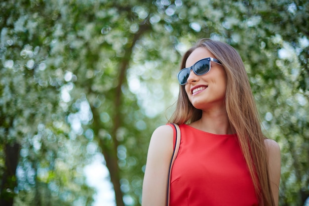 Smiling young woman outdoors