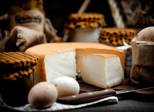 Free Photo smoked cheese on a wooden hemp