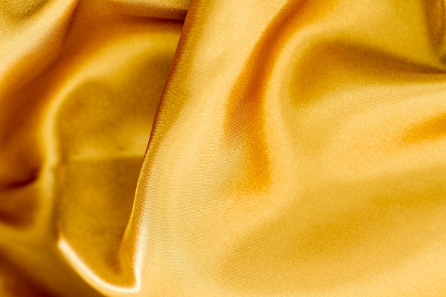 Free photo smooth elegant golden fabric material texture