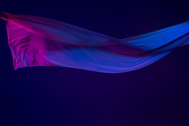 Smooth elegant transparent blue cloth separated on blue