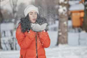 Free photo snow background jacket woman hair