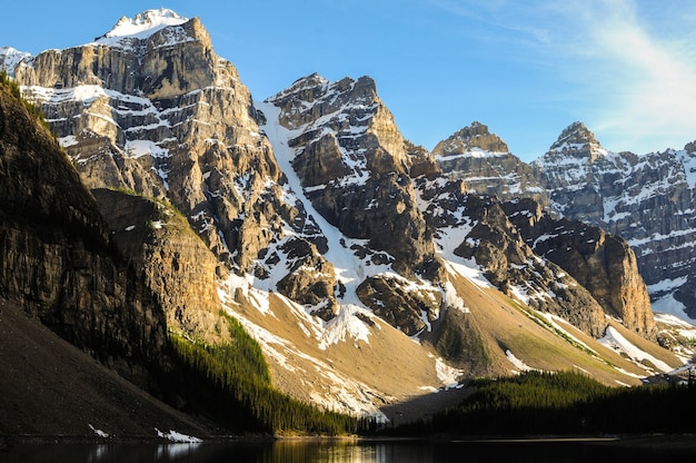 Snow-covered mountain peaks near the Moraine Lake in Canada