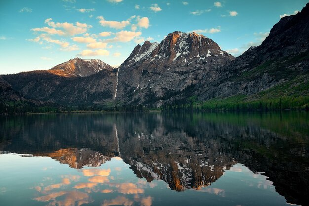 Snow mountain cloud and lake with reflections in Yosemite.