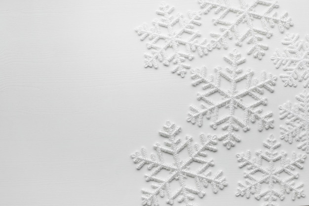 Free photo snowflakes on white surface