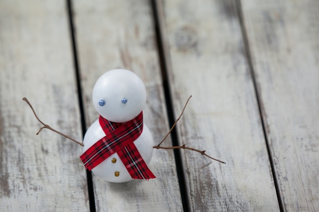 Free Photo snowman on a wooden table