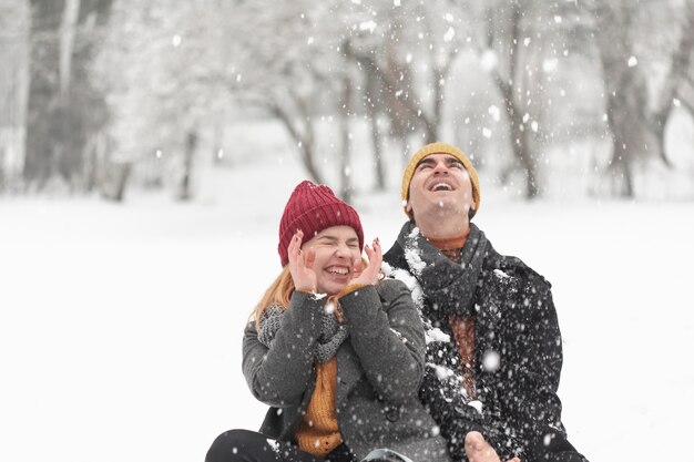 Snowy day and couple in the park