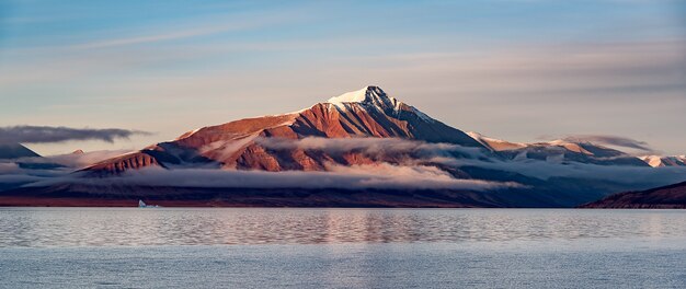 Snowy mountain over lake, beautiful landscape