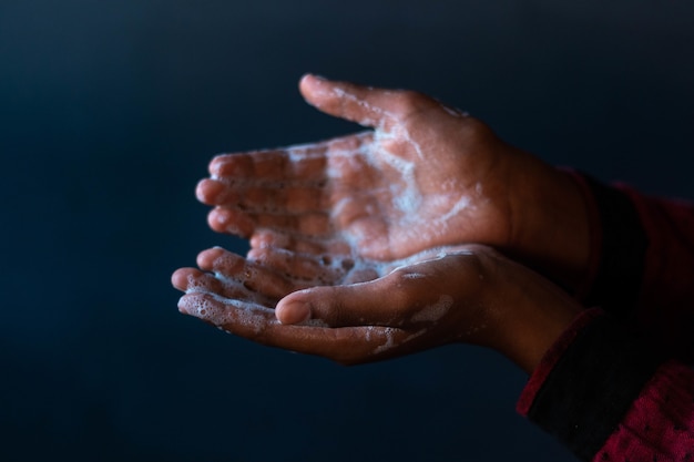 Free photo soaped hands of a person - importance of washing hands during the coronavirus pandemic