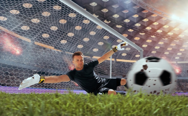 Free photo soccer players in action on professional stadium