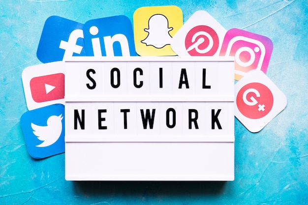 Free Photo social network text with networking application icons on painted wall