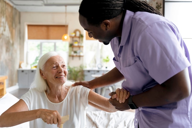 Social worker taking care of a senior woman