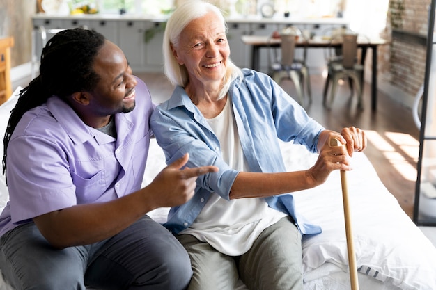 Social worker taking care of a senior woman