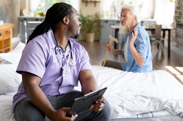 Social worker taking care of a senior woman