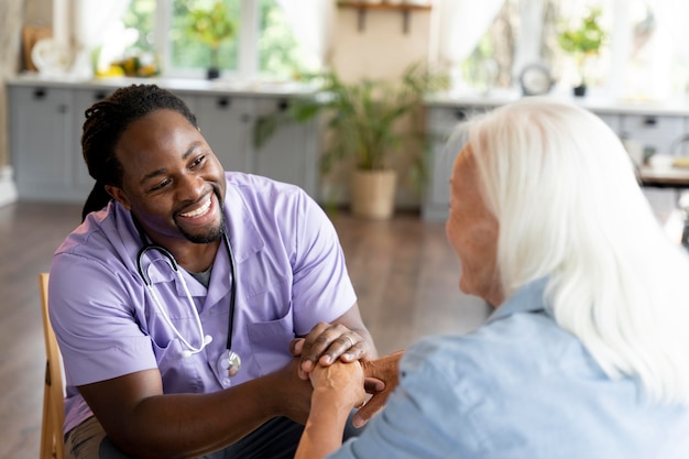 Social worker taking care of a senior woman