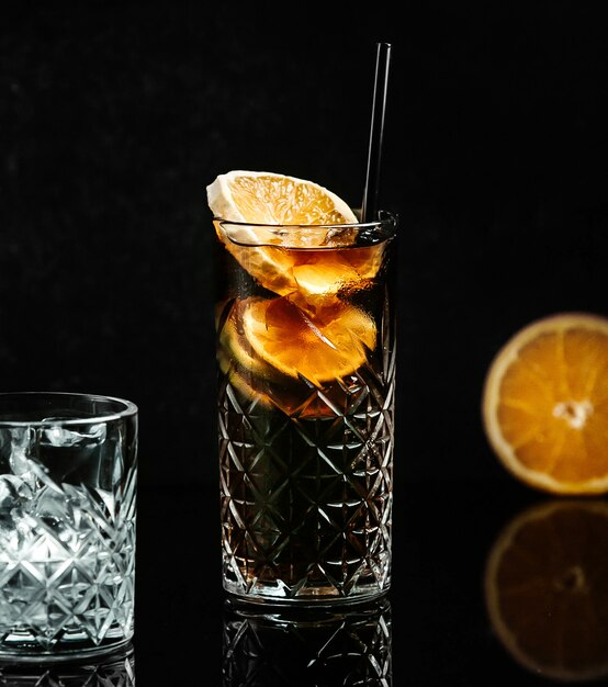 Soda in black glass with lemon slice